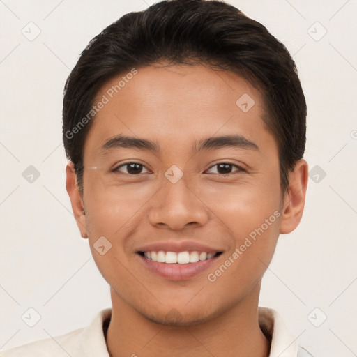 Joyful latino young-adult male with short  brown hair and brown eyes