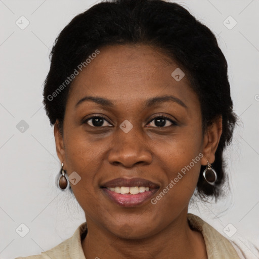 Joyful black adult female with medium  brown hair and brown eyes