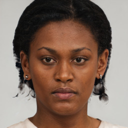 Neutral black young-adult female with short  brown hair and brown eyes