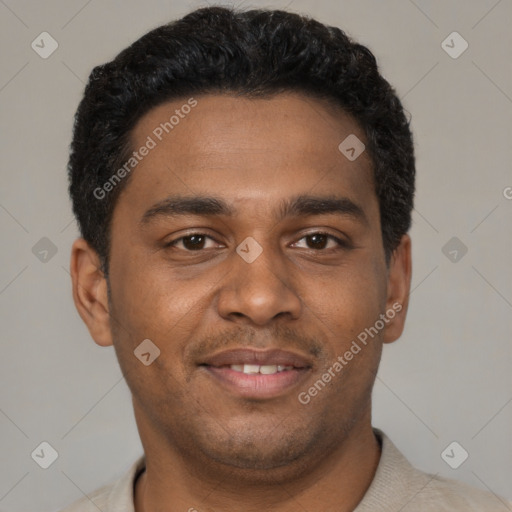 Joyful black young-adult male with short  black hair and brown eyes