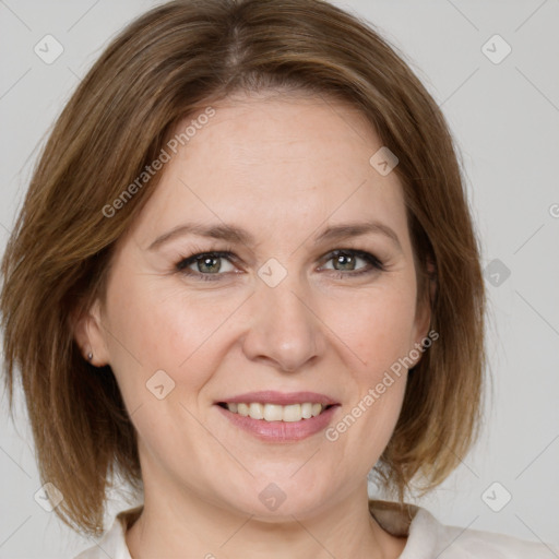 Joyful white adult female with medium  brown hair and grey eyes