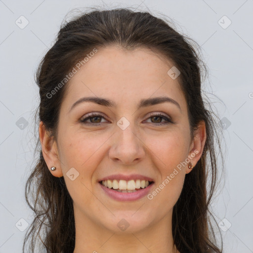 Joyful white young-adult female with long  brown hair and brown eyes