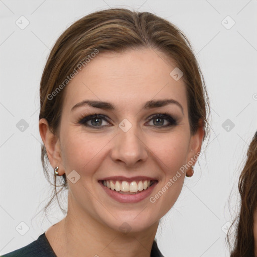 Joyful white young-adult female with medium  brown hair and grey eyes