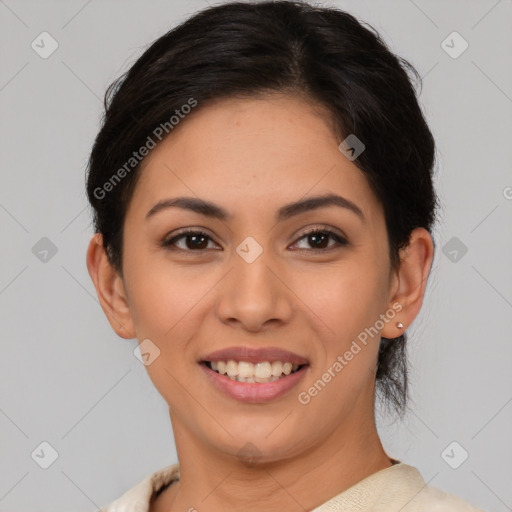 Joyful latino young-adult female with short  brown hair and brown eyes