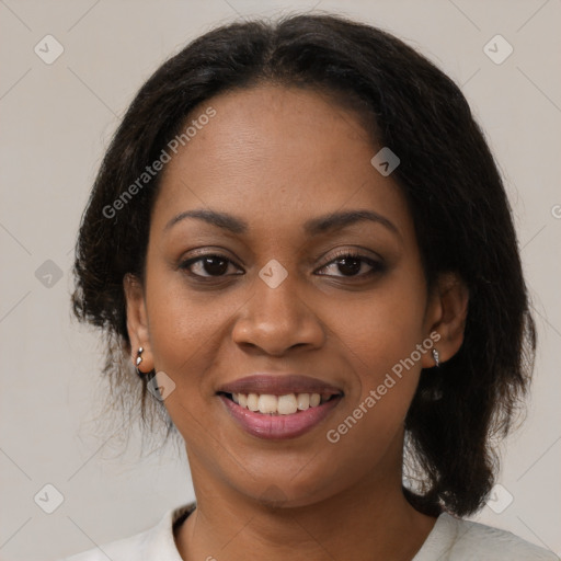 Joyful black young-adult female with medium  brown hair and brown eyes