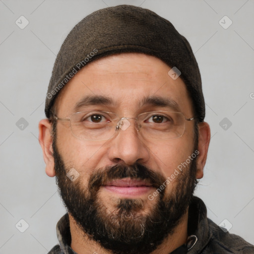 Joyful white adult male with short  black hair and brown eyes