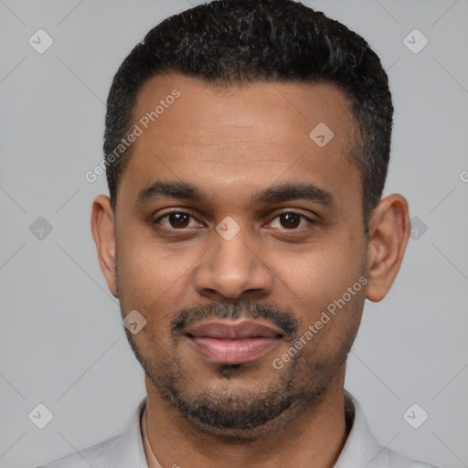 Joyful latino young-adult male with short  black hair and brown eyes