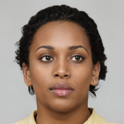 Neutral black young-adult female with short  brown hair and brown eyes