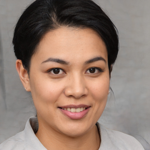 Joyful white young-adult female with medium  brown hair and brown eyes