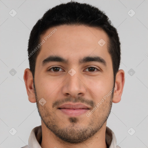 Joyful latino young-adult male with short  black hair and brown eyes