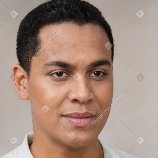 Joyful latino young-adult male with short  black hair and brown eyes