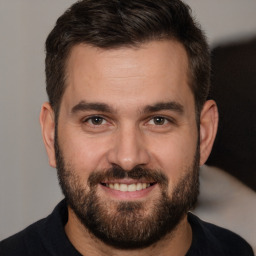 Joyful white young-adult male with short  brown hair and brown eyes