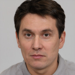 Neutral white adult male with short  brown hair and brown eyes