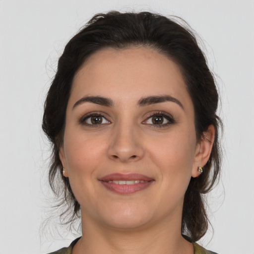 Joyful white young-adult female with medium  brown hair and brown eyes