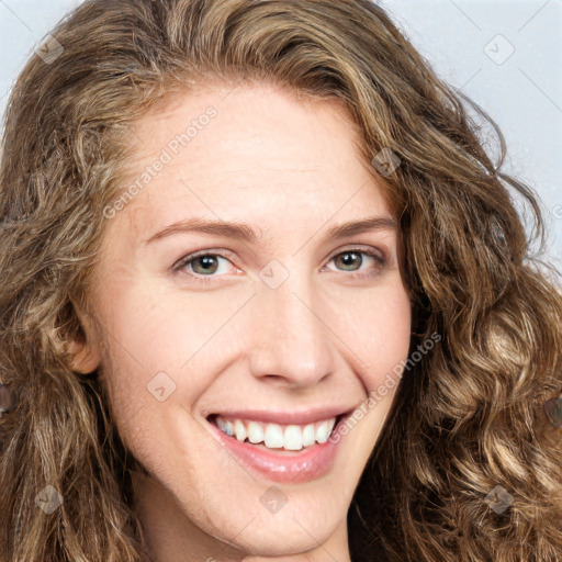 Joyful white young-adult female with long  brown hair and green eyes