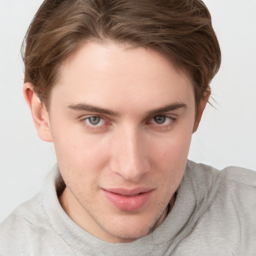 Joyful white young-adult female with short  brown hair and blue eyes