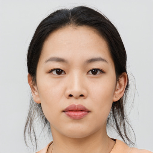 Neutral asian young-adult female with medium  brown hair and brown eyes