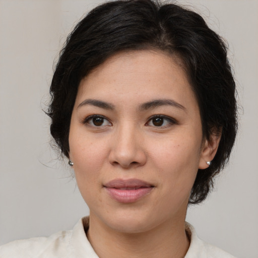 Joyful asian young-adult female with medium  brown hair and brown eyes