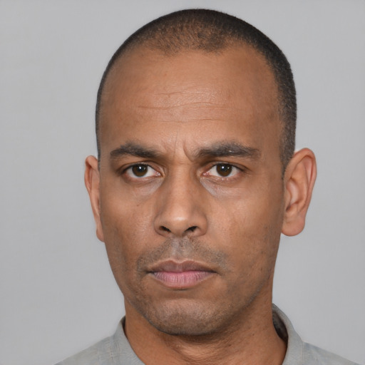 Neutral black adult male with short  black hair and brown eyes