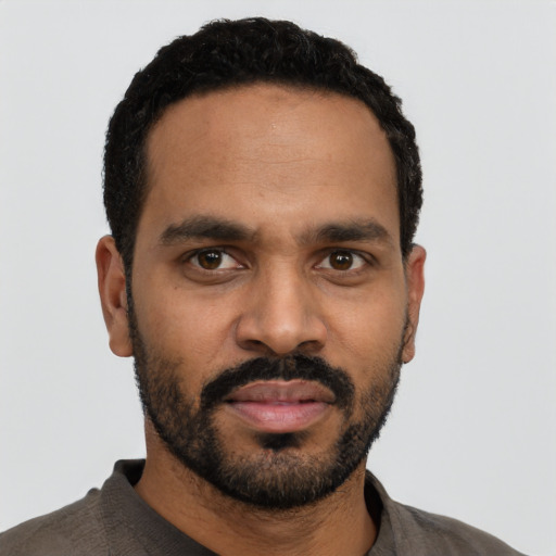 Neutral black young-adult male with short  black hair and brown eyes