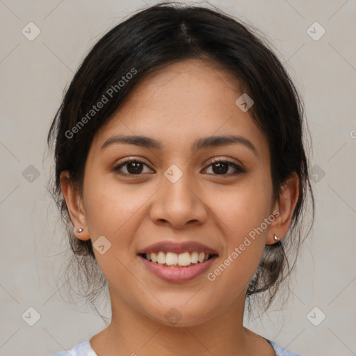 Joyful latino young-adult female with medium  brown hair and brown eyes