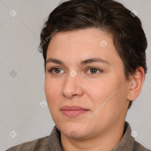 Joyful white adult female with short  brown hair and brown eyes