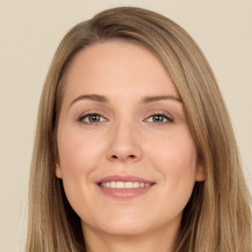 Joyful white young-adult female with long  brown hair and brown eyes