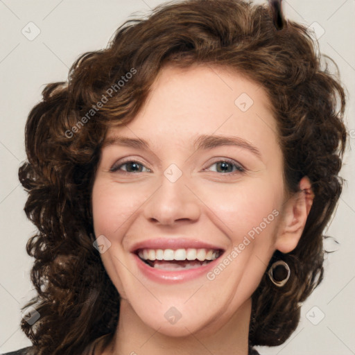 Joyful white young-adult female with medium  brown hair and green eyes