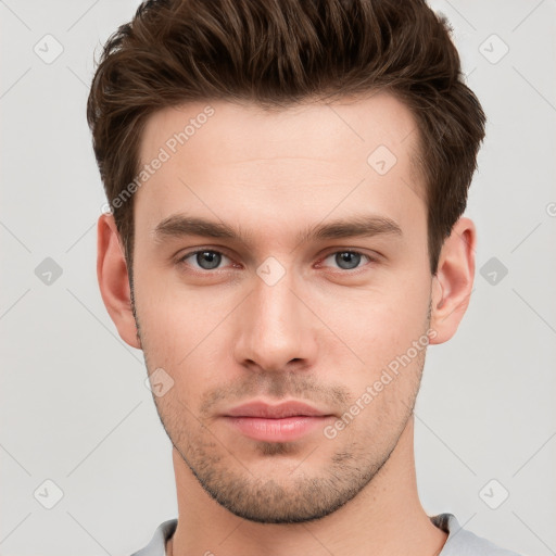 Neutral white young-adult male with short  brown hair and grey eyes