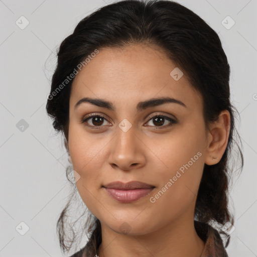 Joyful latino young-adult female with medium  brown hair and brown eyes