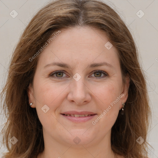 Joyful white adult female with long  brown hair and brown eyes