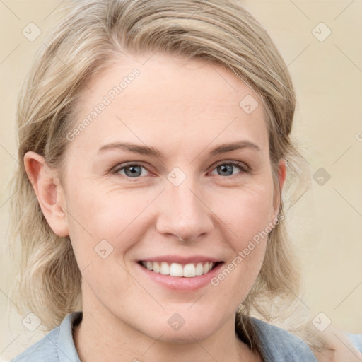 Joyful white young-adult female with medium  brown hair and blue eyes