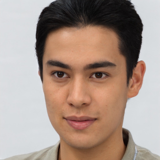 Joyful latino young-adult male with short  brown hair and brown eyes