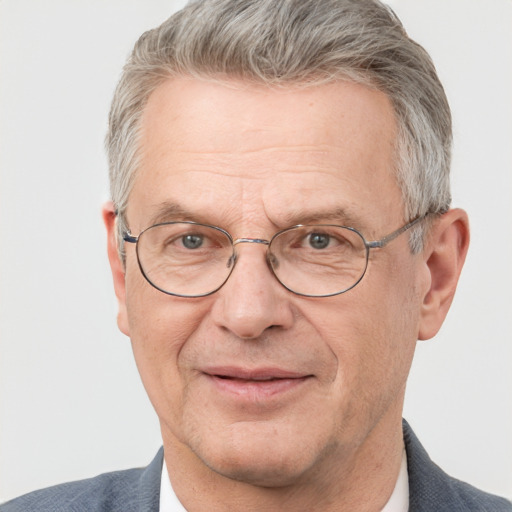 Joyful white middle-aged male with short  gray hair and blue eyes