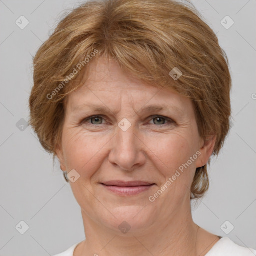 Joyful white adult female with short  brown hair and grey eyes