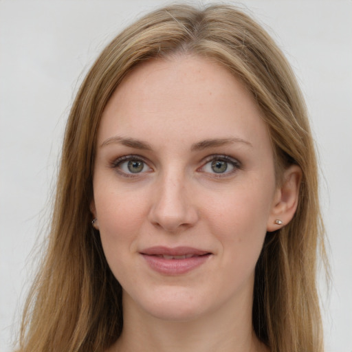 Joyful white young-adult female with long  brown hair and grey eyes