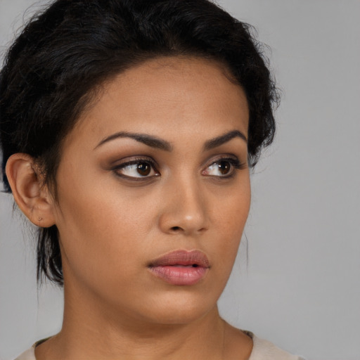 Neutral latino young-adult female with medium  black hair and brown eyes