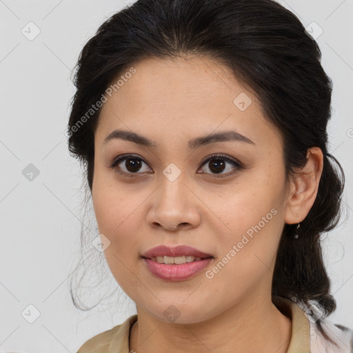 Joyful latino young-adult female with medium  brown hair and brown eyes