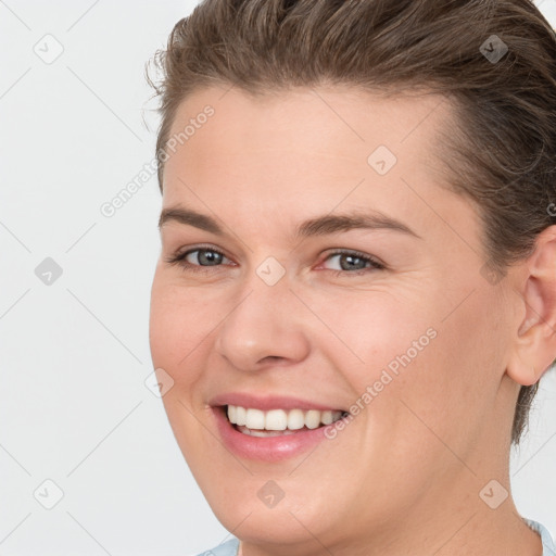 Joyful white young-adult female with short  brown hair and brown eyes