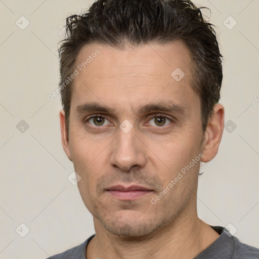 Neutral white adult male with short  brown hair and brown eyes