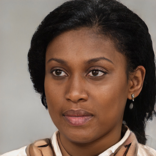 Neutral black young-adult female with medium  brown hair and brown eyes