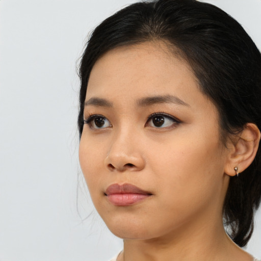 Neutral asian young-adult female with medium  black hair and brown eyes