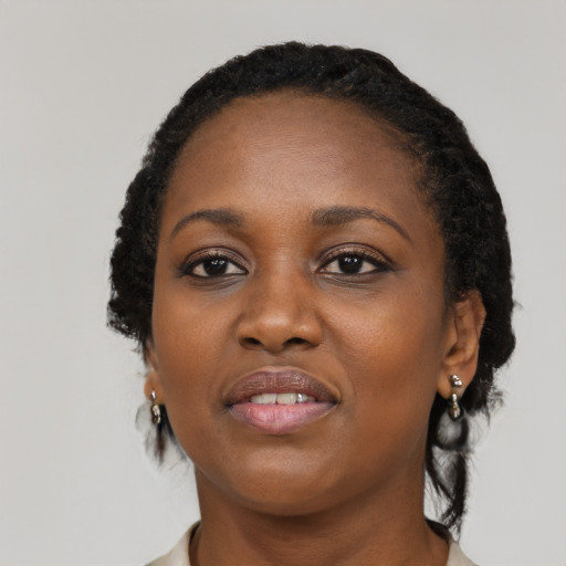 Joyful black young-adult female with medium  black hair and brown eyes