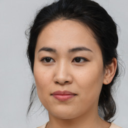 Joyful asian young-adult female with medium  brown hair and brown eyes