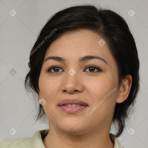 Joyful latino young-adult female with medium  brown hair and brown eyes