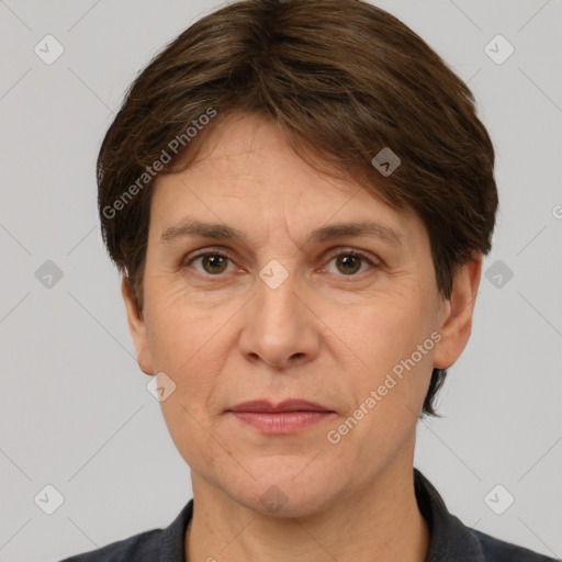 Joyful white adult female with short  brown hair and grey eyes