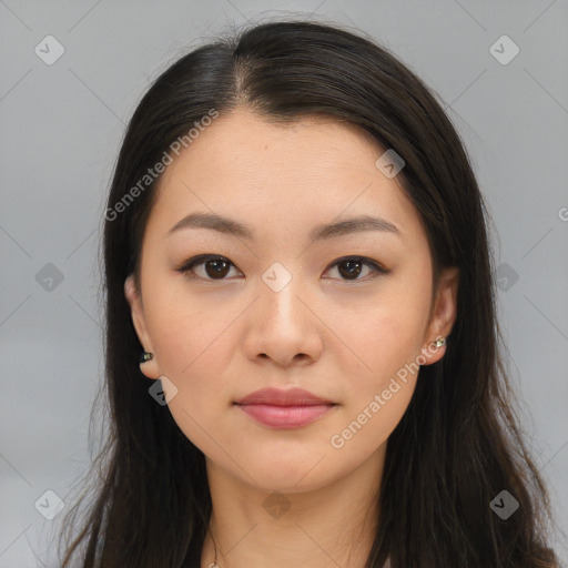 Joyful asian young-adult female with long  brown hair and brown eyes