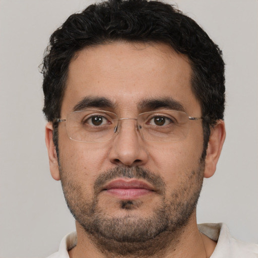 Neutral white adult male with short  black hair and brown eyes