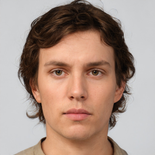 Neutral white young-adult male with short  brown hair and green eyes