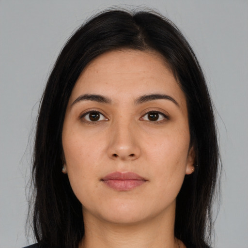 Neutral latino young-adult female with long  brown hair and brown eyes